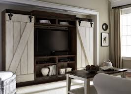Sliding barn doors are an elegant internal door solution in the home, taking up minimal space while also looking great. Liberty Furniture Lancaster Rustic Entertainment Center With Sliding Barn Doors Royal Furniture Wall Unit