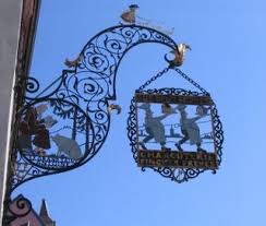 Butcher S Shop Sign Designed By Hansi Spot The Attentive Pig At Feet Of St Antony Patron Saint Of Charcutiers Fahnen Warnschild Schilder