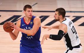 Denver nuggets center nikola jokic, right, shoots as los angeles clippers center ivica zubac defends during the second half of an nba basketball game saturday, may 1, 2021, in los angeles. Playoff Preview Denver Nuggets Versus Los Angeles Clippers