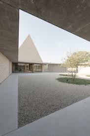 The Triangular Profile Frames The Interior Of A Double Height Funeral Hall Which Is Lit From Above By A Architecture Minimal Architecture Church Architecture