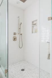 Depending on the type of flooring in your bathroom, you may need to install a subfloor. White And Gray River Rock Shower Floor Tiles Transitional Bathroom
