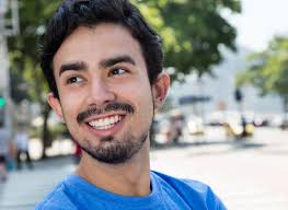 Smart Hispanic Guy in the City Stock Image