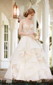 The top of this dress is nylon chiffon covered in lace with lace trim, beaded applique & spaghetti straps. Layered Skirt Wedding Separates Martina Liana Wedding Dresses