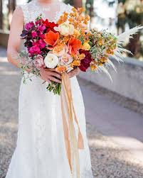 In this bouquet, the bright colors and greenery pop against the brides stunning vintage dress. 58 Jaw Droppingly Beautiful Bouquets For Summer Wedding To Obsess Over