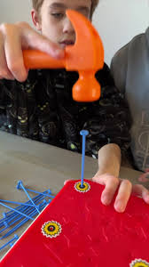 Interactive Fun with a Toy Hammer and Pegs