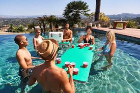 This Pool Float Doubles As A Beer Pong Table And We Officially Can T Wait For Summer Floating Beer Pong Table Beer Pong Tables Pool Beer Pong