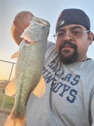 Where should the second sign for Community Fishing Lakes regulations be  placed at Ascarate Lake?