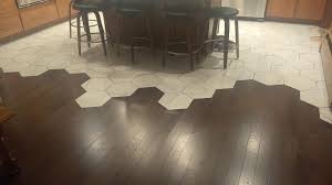 Jan 13, 2020 · three types of tile lend luxury to this modern farmhouse bathroom: Full Width View Of The Wood Floor To Hexagonal Tile Transition Kitchen To Family Room Woodworking
