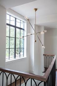 Houzz Tour Eclectic Down Home Style In Texas Lounge Lighting Stair Lighting Modern Brass Lighting