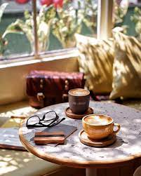 Keepcup volumes reflect disposable cups commonly used in cafes around the world. Image May Contain People Sitting Coffee Cup Table And Indoor