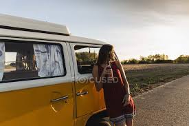 It's where your interests connect you with your people. Pretty Woman On A Road Trip With Her Camper Taking A Break At Sunset Girl Downshifting Stock Photo 283118512