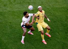 Why is Jordan Ayew wearing a bandage on his head for Ghana against England?