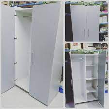 for sale wood cabinet 2 door size 95 180 new price 23 bd للبيع كبت ملابس بابين لون ابيض مع رصاصي مقاس 95 180 جدي locker storage storage home decor