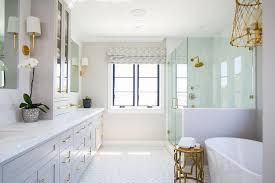 It's snuck up on me slowly but we are talking full takeover now. Gray Master Bath With Gold Accents Transitional Bathroom