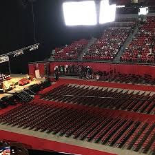 thomas and mack center for a graduation picture of thomas