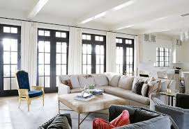 I like its natural cowhide pattern finished with solid nailhead trims. Cowhide Ottoman With Brass Legs Transitional Living Room