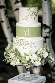This White Wedding Cake With Green Floral Designs Is A Beautiful Choice For A Spring Wedding Celebration Green Wedding Cake Summer Wedding Cakes Flower Cake