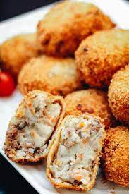 Crispy on the outside and tender on the inside, these fried croquettes made with braised beef make great party appetizers. Korokke Potato Meat Croquette ã‚³ãƒ­ãƒƒã‚± Recipe Croquettes Beef Croquettes Recipe Savory Snacks
