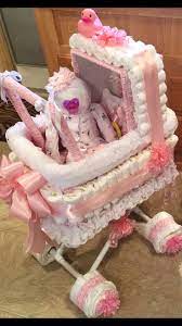 Instead Of A Diaper Cake For Baby Shower I Made My Daughter A Diaper Stroller With A Diaper Baby Sitting I Baby Shower Diy Baby Shower Diapers Diaper Stroller