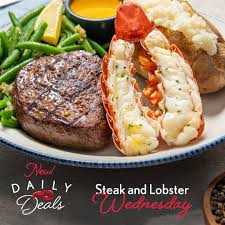 Photo about prepared surf and turf well done steak and lobster meal with side dishes of crab cakes, shrimp and mayonnaise dip on blue wooden table. Red Lobster You Can Sleep Easy Tonight Knowing You Ll Dream Of Sirloin With Peppercorn Seasoning And A Wild Caught Lobster Tail For Only 19 99 That S Right Tomorrow Is Steak And Lobster Wednesday