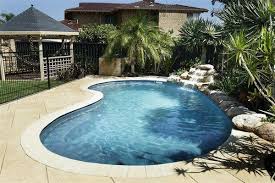 60 Spectacular Kidney Shaped Swimming Pool Designs For Your Patio Kidney Shaped Pool Swimming Pool Designs Backyard Pool