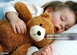 Sick Girl Laying In Bed With Teddy Bear High-Res Stock Photo