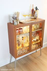 Liquor cabinet, household bar and jukebox in one sideboard. How To Diy A Retro Mid Century Cocktail Cabinet For Your Festive Parties
