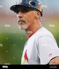 St. Louis Cardinals first base coach Stubby Clapp (82) watches from the  dugout in the fourth inning of a spring training baseball game against the  Washington Nationals, Friday, March 25, 2022, in