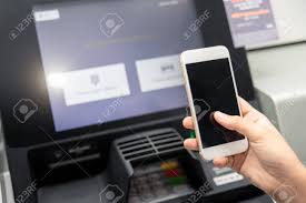 Here we have everything you need. Withdraw Money From An Atm Without Using A Credit Card Person Holding A Phone With A Login Screen For Mobile Banking Transaction Business Online Stock Photo Picture And Royalty Free Image Image 122474703