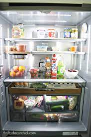 Kitchenaid fridge with wood accents. Refrigerator With Wood Accents And Bright Lights Modern Kitchen Interiors Refrigerator Organization Kitchen Aid