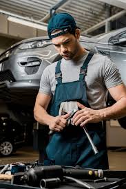 Start with a workable auto mechanic resume template. Portrait Of Auto Mechanic In Uniform With Lug Wrench At Auto Repair Shop Free Stock Photo And Image