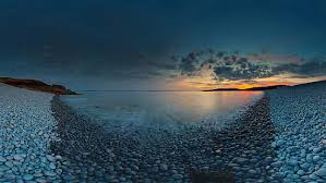 Explore the aesthetic of a stained glass texture with a collection of these abstract backgrounds. Hd Wallpaper Gray Stones Beside Body Of Water Costa Del Sol Beach Sand Wallpaper Flare