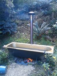 How Cool A Fire Underneath Heats The Water In The Bath A Wooden Platform In The Bath Keeps Your Skin Off The Hot Su Outdoor Bathtub Outdoor Baths Outdoor Tub
