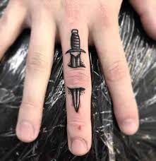 This tattoo includes a simple black inked arrow that appears on the side of the middle finger. Finger Tattoos For Men Small Novocom Top