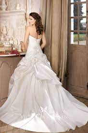 The satin is lined with cotton and there is another layer of tulle underneath to provide a full look without compromising the way the fabric hangs. Ivory Ball Gown Wedding Dress With Pick Up Skirt Vq