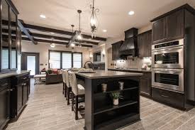 This dramatic wood kitchen floor is made from tanzanian wenge hardwoods. Dark Wood Kitchen Cabinets Hmdcrtn