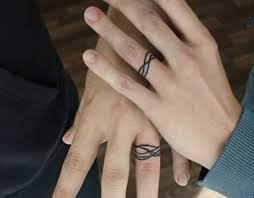 Source lettering ring tattoo art. To Tat Or Not To Tat Is A Wedding Ring Tattoo Right For You