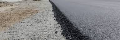 The edges of an asphalt driveway need to be cut straight so that the blocks line up evenly against it. Asphalt Edges How Should The Edges Be Finished On An Asphalt Driveway