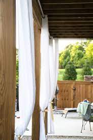How To Hang Outdoor Drapes Diy Outdoor Curtain Rods Polka Dot Chair Outdoor Drapes Outdoor Curtains Diy Patio