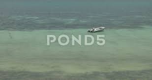 According to the cia world factbook, it covers 28 percent of the earth and is equal in size to nearly all of the land area on the earth. View Of Boat In Indian Ocean Of The Coast Of Mombasa Kenya Stock Footage Ad Indian Ocean View Boat Indian Ocean Tourism In Kenya Mombasa Beach