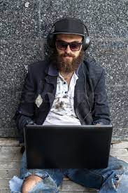 (noun) an example of a vagrant is a homeless person who travels from place t. Vagrant Using Laptop Near The Wall Stock Image Colourbox