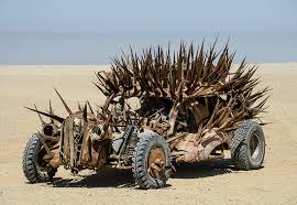 This car is actually seen on this picture it is hard to make out but it is seen driving next to the weary wide tire pole truck on the far right end of the photo. The Badass Vehicles Of Mad Max Fury Road