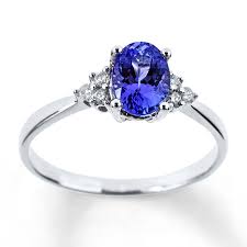 An Oval Tanzanite Is The Vibrant Focal Point Of This Lovely 10k White Gold Ring For Her Trio Tanzanite Engagement Ring Tanzanite Diamond Ring Buy Diamond Ring