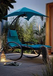 Sunbrella offers slipcovered chaise lounges, patio lounge chairs and ottomans as well as cushions for wicker and resin wicker furniture. Get The Ultimate Vip Experience Right From The Heart Of Your Garden This Helicopter Chair Not Only Lets You Unwind In Com Garden Chairs Outdoor Lounge Outdoor