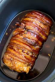 Place the tenderloin about 1/3 of the way down from the top of the bacon and, using a basting brush, generously brush the tenderloin with the dijon spread (being sure to coat ends and both sides). Slow Cooker Bacon Garlic Pork Loin Dinner Then Dessert