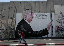 This my be one of the most iconic drawings by banksy: 2 Huge Trump Murals Appear On West Bank Barrier