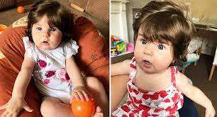 Five-month-old baby gets mistaken for doll thanks to shoulder-length hair