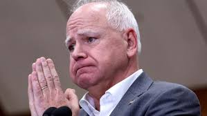 Tim Walz faces protests and silent treatment during school appearance amid 'Touchdown Timmy' allegations