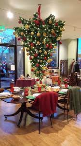 What to do with an old christmas tree. Upside Down Christmas Tree Over The Dining Room Table In The Pomegranate Seeds Store Christmas Table Decorations Christmas Table Christmas Deco