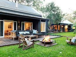 Our coastal furniture collection helps customers create a unique beach house feel whether it be a cottage by the sea, a lakeside retreat, oceanfront home or an abode dreaming of the sea. Fire Pit Black Weatherboard Luxury Beach House House Exterior Holiday Home